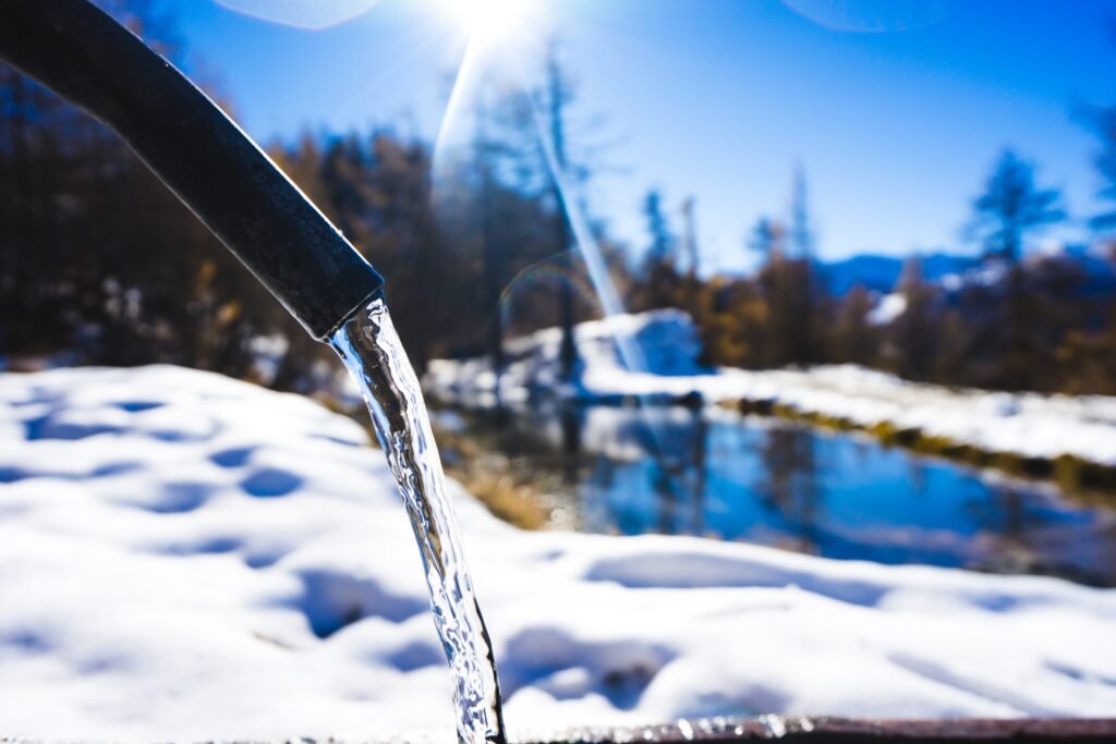 natural mountain water source in winter landscape